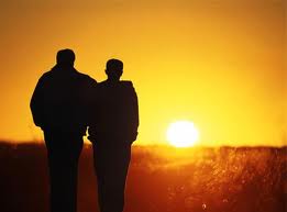 father-talking-to-son-in-sunset